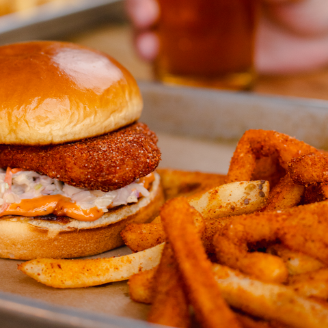 Fish with fries and a drink on a tray