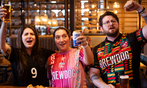 people cheering for the world cup game. 